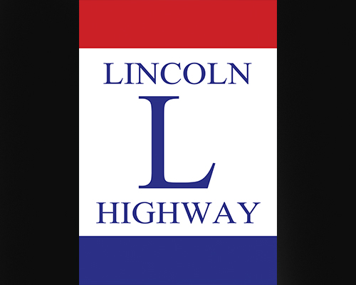 logowith a red top, white middle with the words Lincoln Highway and a capital L and blue bottom